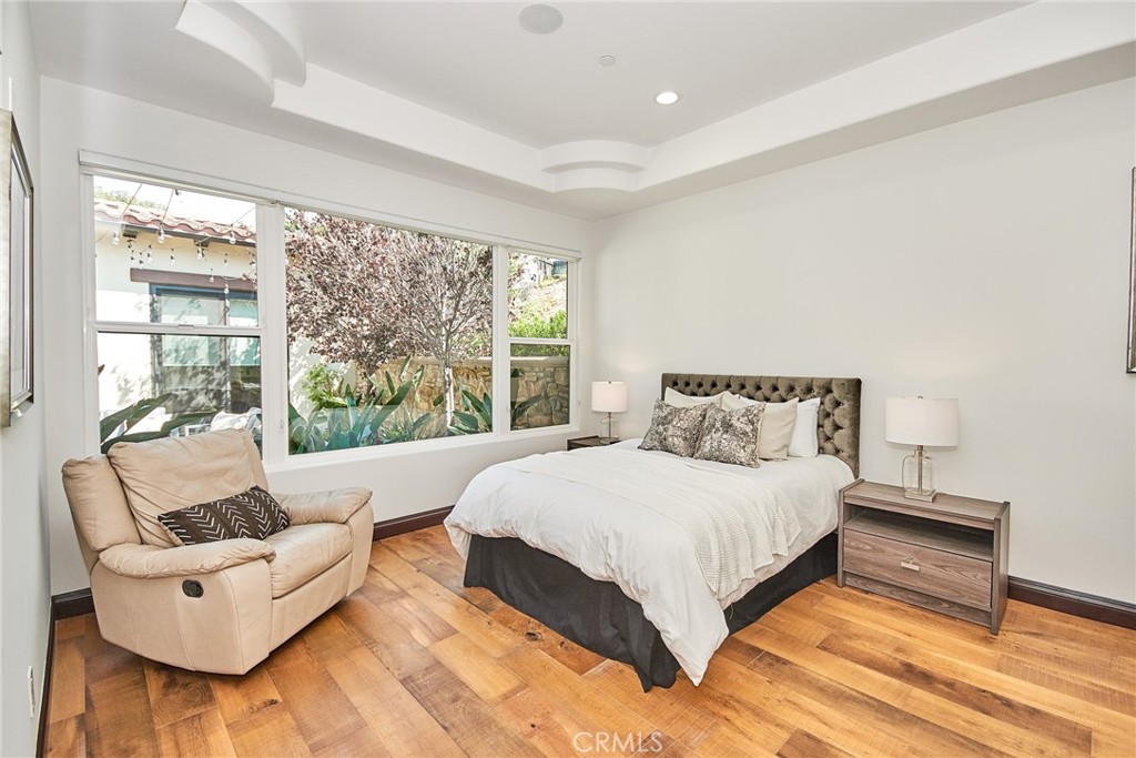 1051 Arroyo Drive Fullerton, CA 92833 - Photo 69 of 73 a bedroom with a bed and a large window