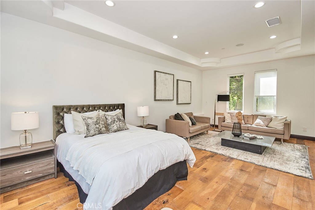 1051 Arroyo Drive Fullerton, CA 92833 - Photo 70 of 73 a spacious bedroom with a bed a couch and dresser