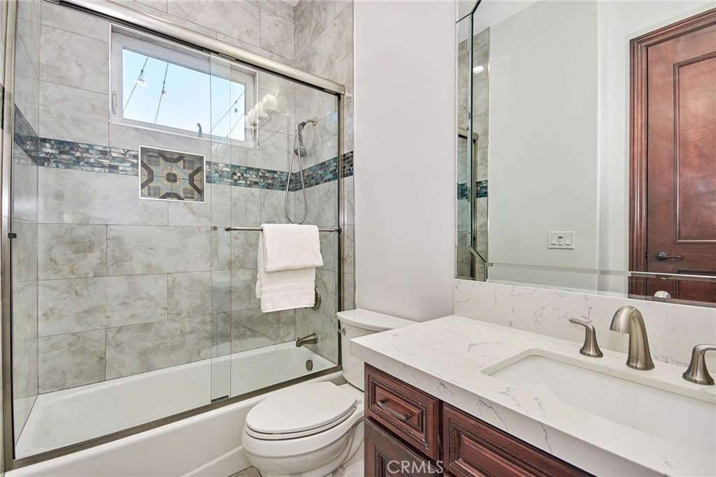 1051 Arroyo Drive Fullerton, CA 92833 - Photo 73 of 73 a bathroom with a granite countertop sink a toilet and shower