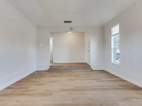 a view of an empty room and window
