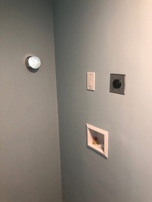 63 River Street, Unit 1 Middleton, MA 01949 - Photo 17 of 19 a view of a blue wall with a window