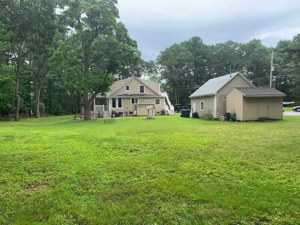 63 River Street, Unit 1 Middleton, MA 01949 - Photo 4 of 19 a view of a house with a yard from a house