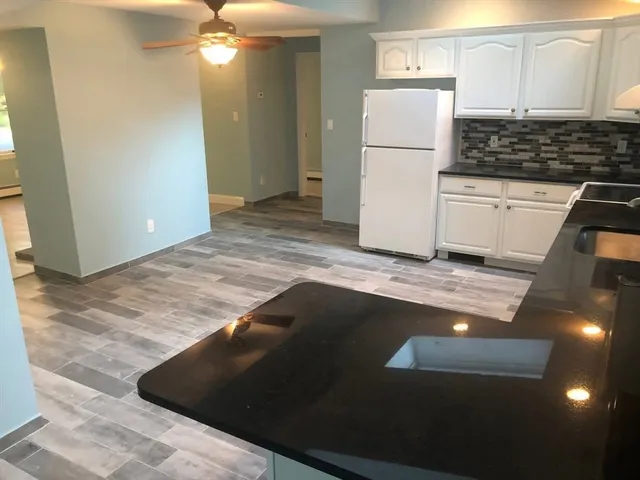 a view of a kitchen with a sink