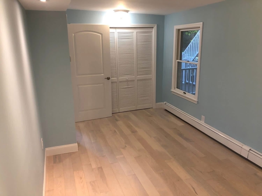 63 River Street, Unit 1 Middleton, MA 01949 - Photo 10 of 19 an empty room with windows