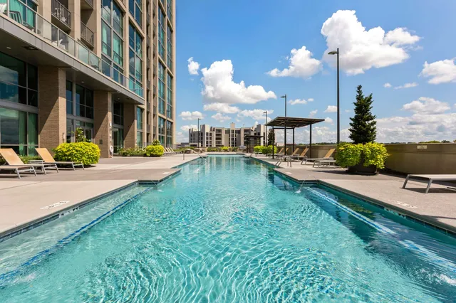 a view of a swimming pool with a lounge chairs