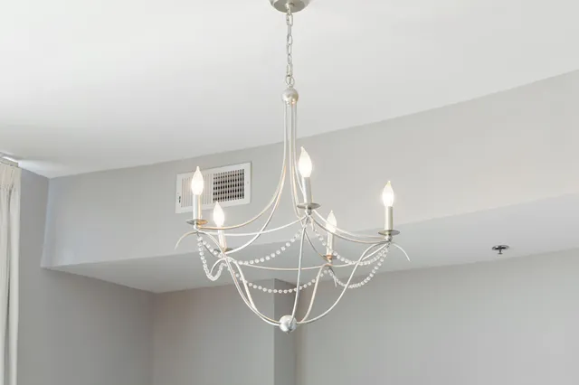 a room with a table a window and couch