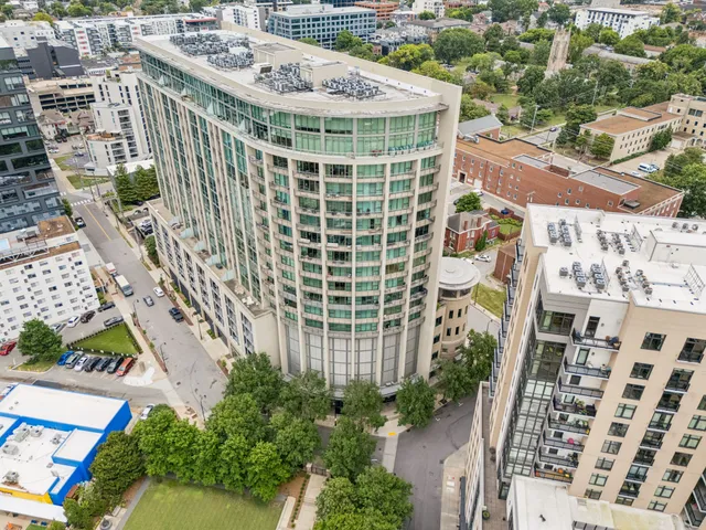 a view of a kitchen with a large window and chairs