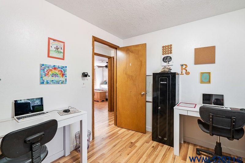 6305 Ruggles Avenue South Salem, OR 97306 - Photo 23 of 42 a view of a workspace with furniture and wooden floor