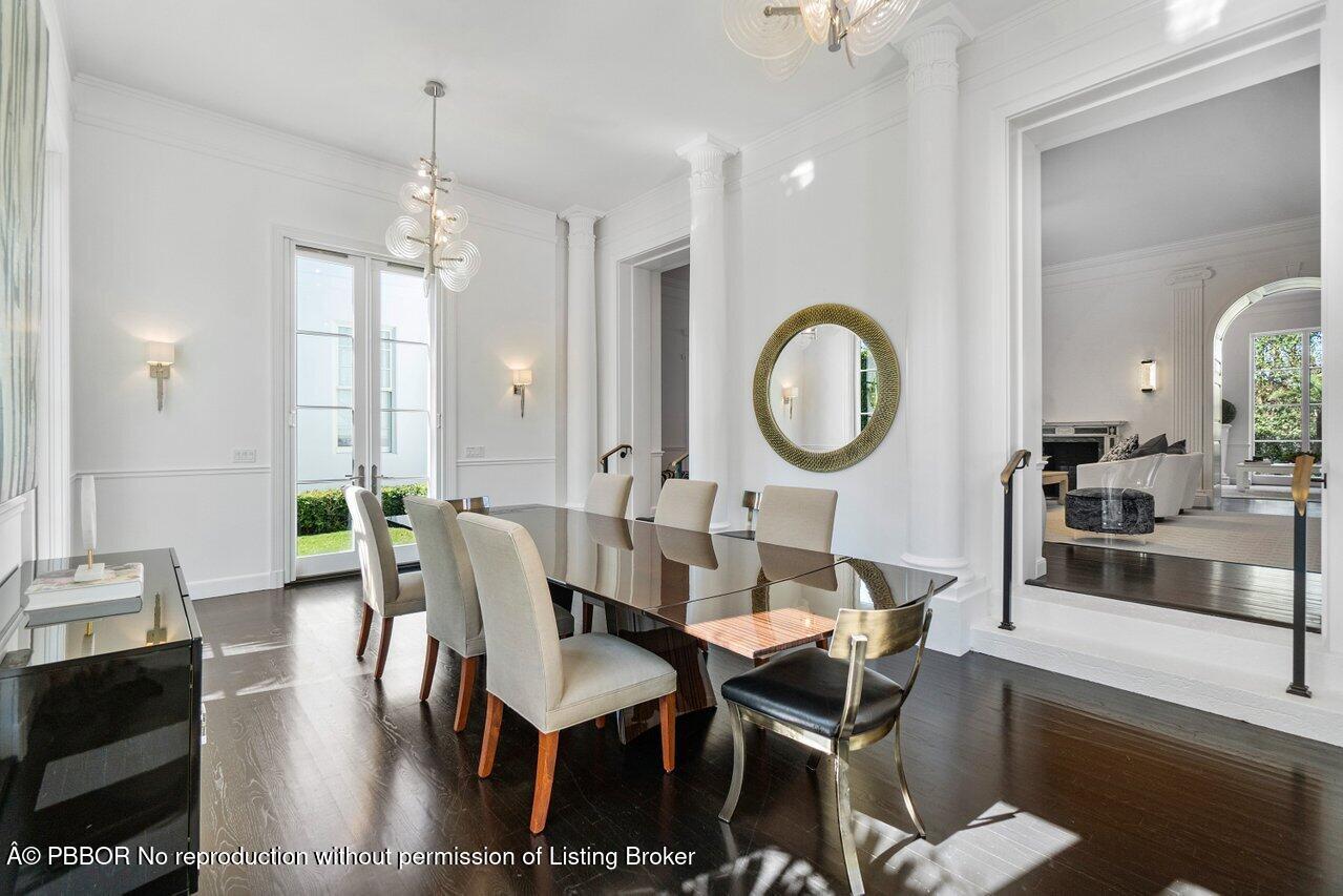 100 Regents Park Road Palm Beach, FL 33480 - Photo 14 of 42 a dining room with wooden floor a glass table and chairs