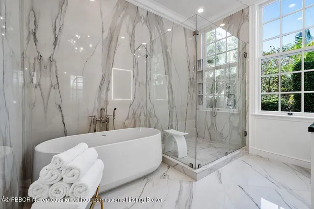 a bathroom with a bathtub and shower