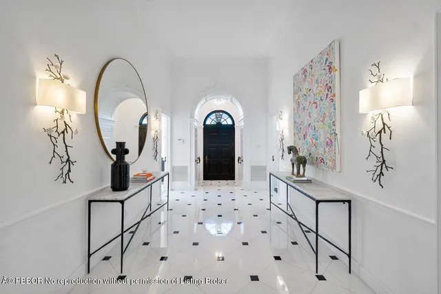 a view of a hallway with entryway wooden floor and front door