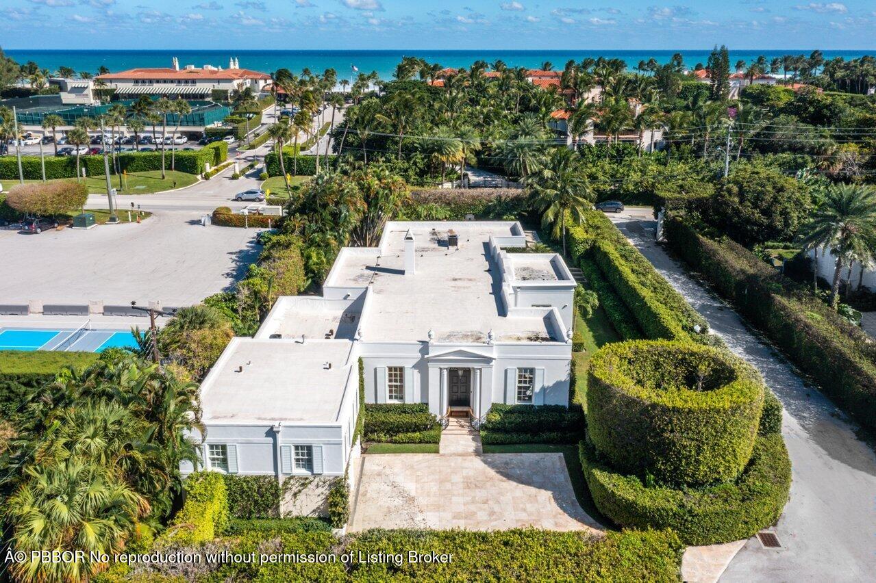 100 Regents Park Road Palm Beach, FL 33480 - Photo 39 of 42 an aerial view of a house with a garden and lake view