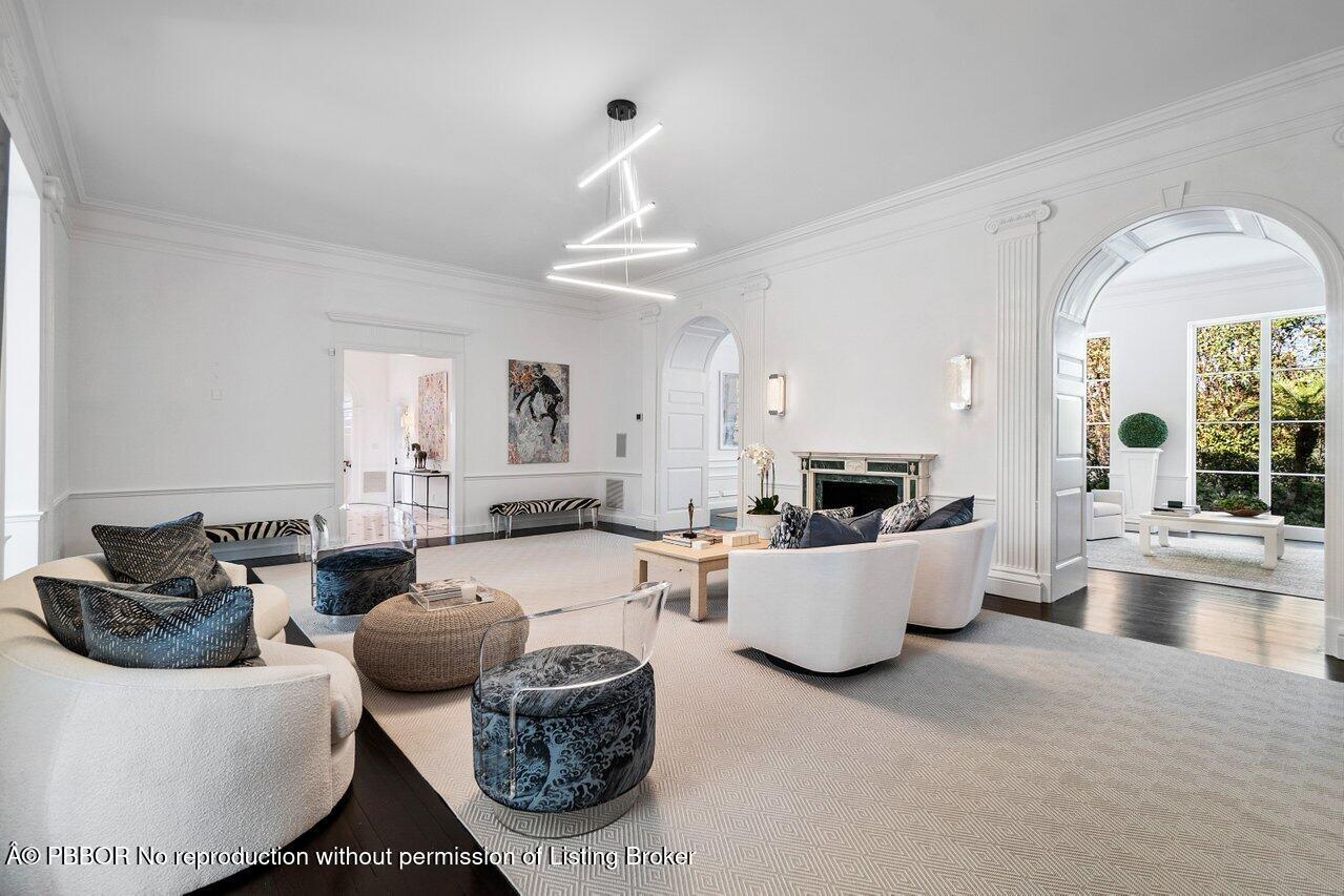100 Regents Park Road Palm Beach, FL 33480 - Photo 6 of 42 a living room with furniture and a large window