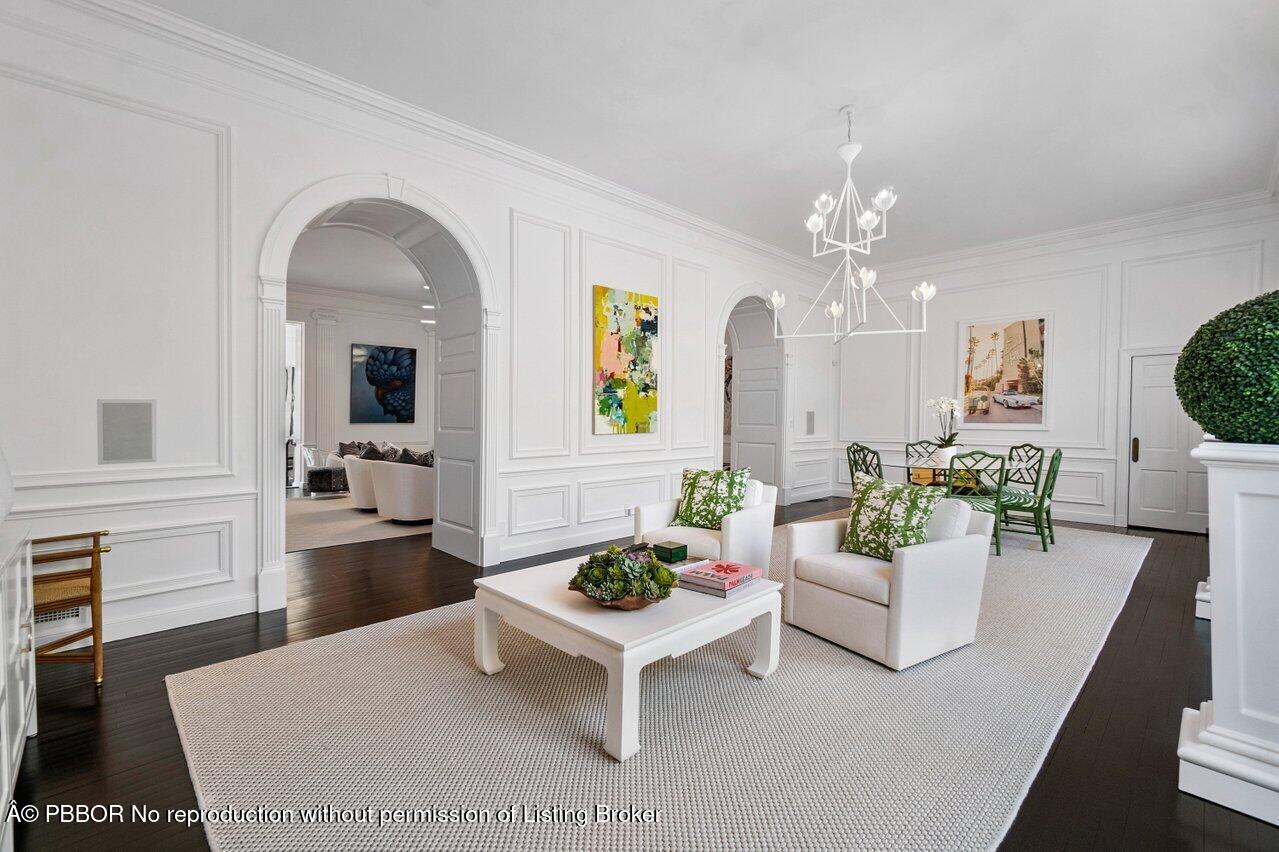 100 Regents Park Road Palm Beach, FL 33480 - Photo 8 of 42 a living room with furniture and a chandelier