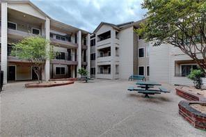 501 West 26th Street, Unit 314 Austin, TX 78705 - Photo 2 of 3 a view of pool with outdoor seating and house in the background