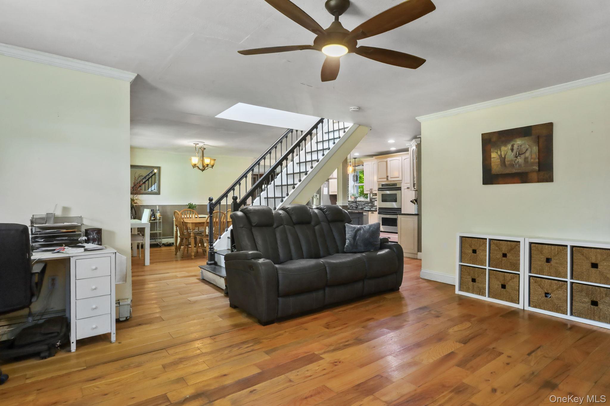 487 Chestnut Ridge Road Dover Plains, NY 12522 - Photo 11 of 41 a living room with furniture a ceiling fan and a rug