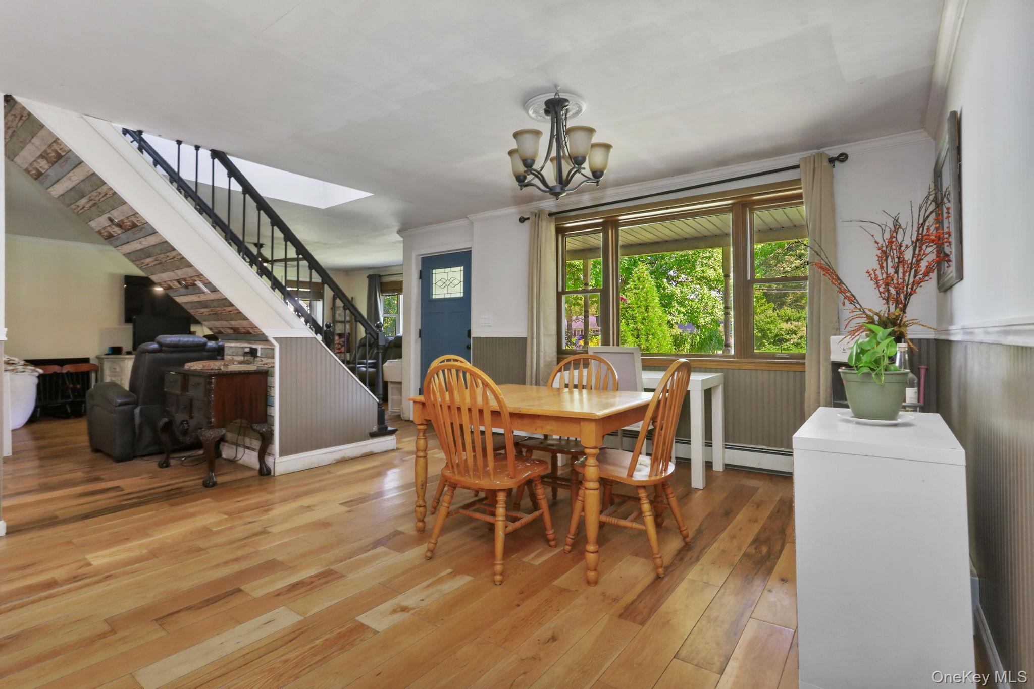 487 Chestnut Ridge Road Dover Plains, NY 12522 - Photo 12 of 41 a view of a dining room with furniture window and wooden floor