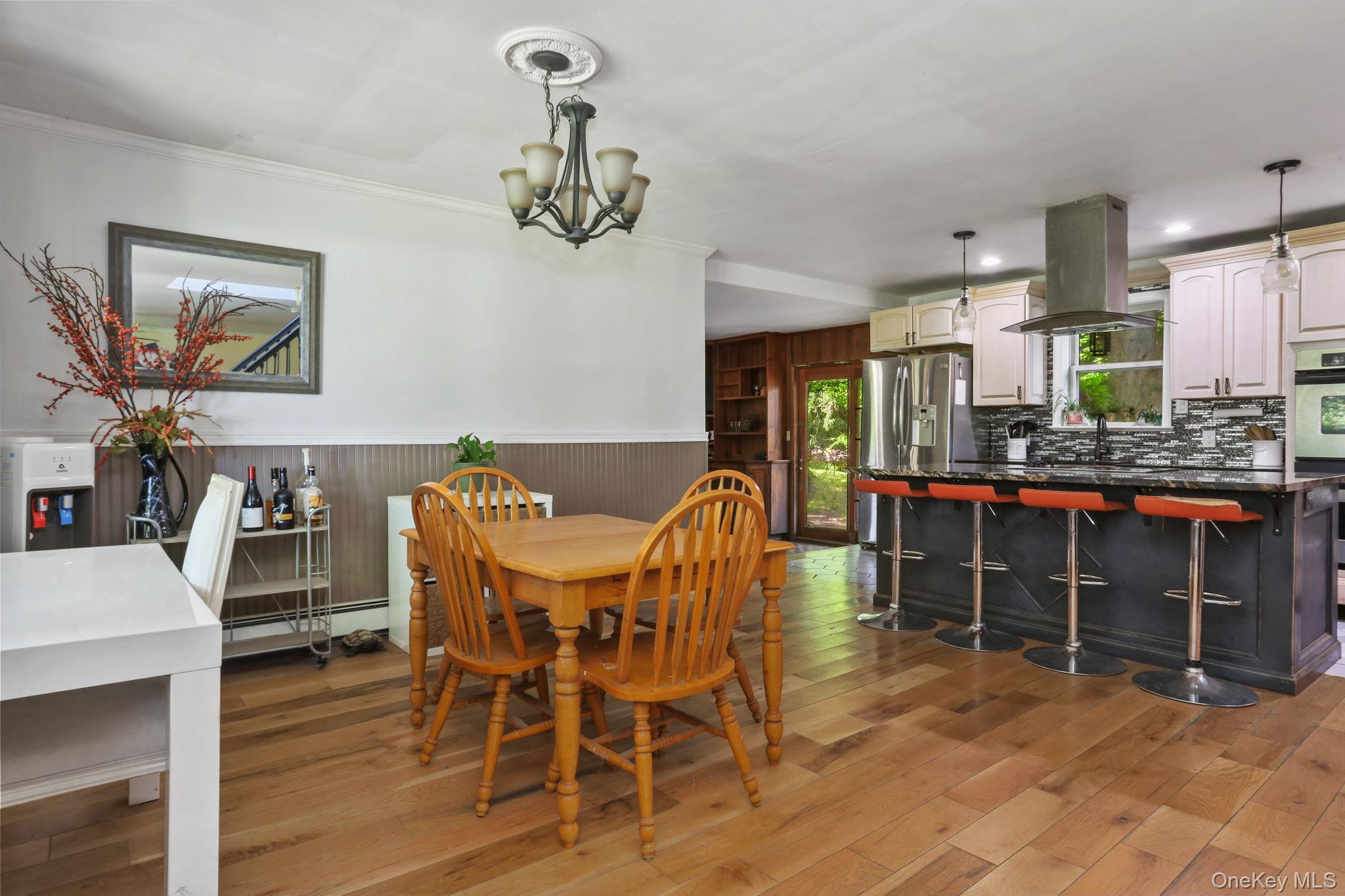 487 Chestnut Ridge Road Dover Plains, NY 12522 - Photo 13 of 41 a view of a dining room with furniture and chandelier