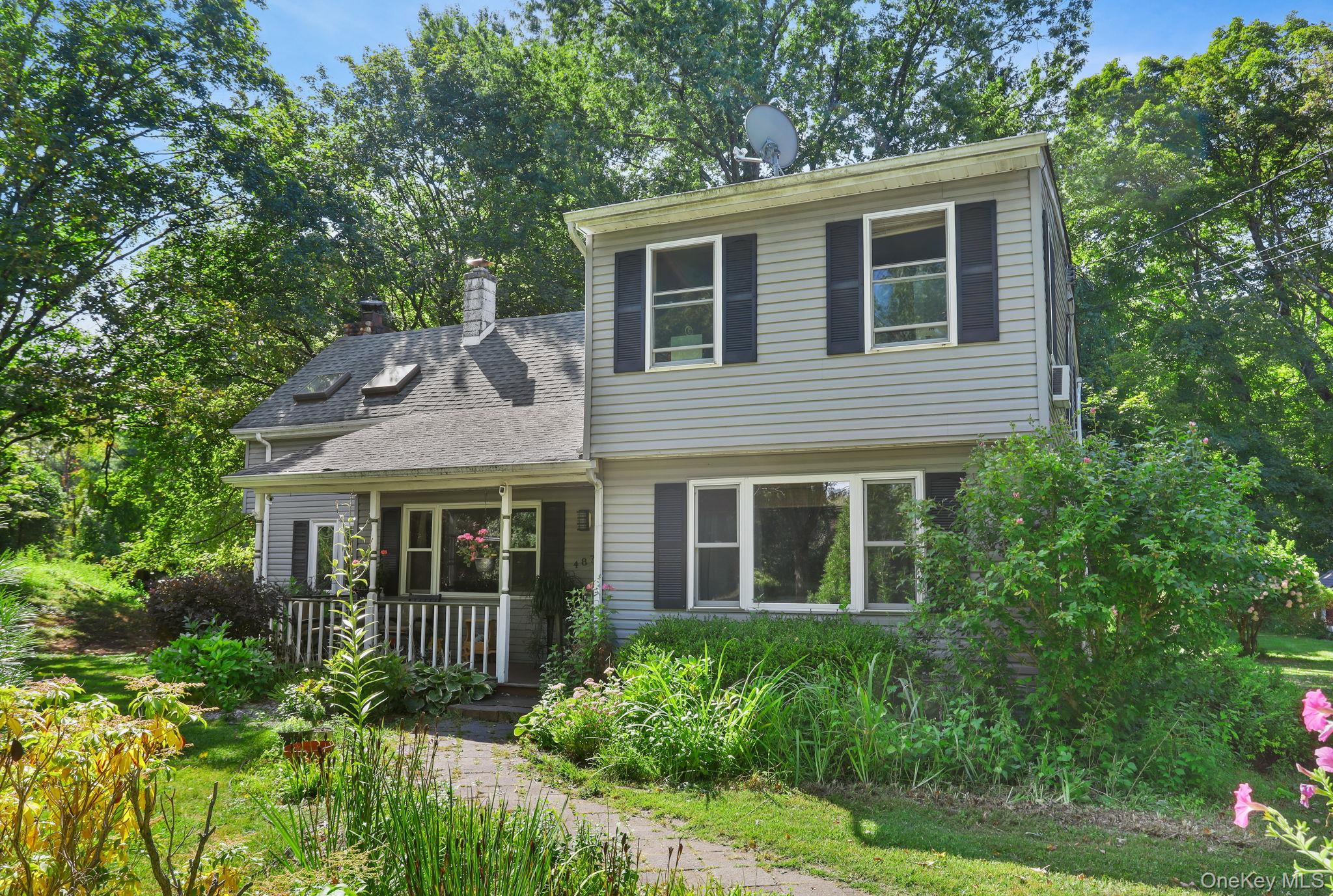487 Chestnut Ridge Road Dover Plains, NY 12522 - Photo 2 of 41 a view of a house with a yard and plants