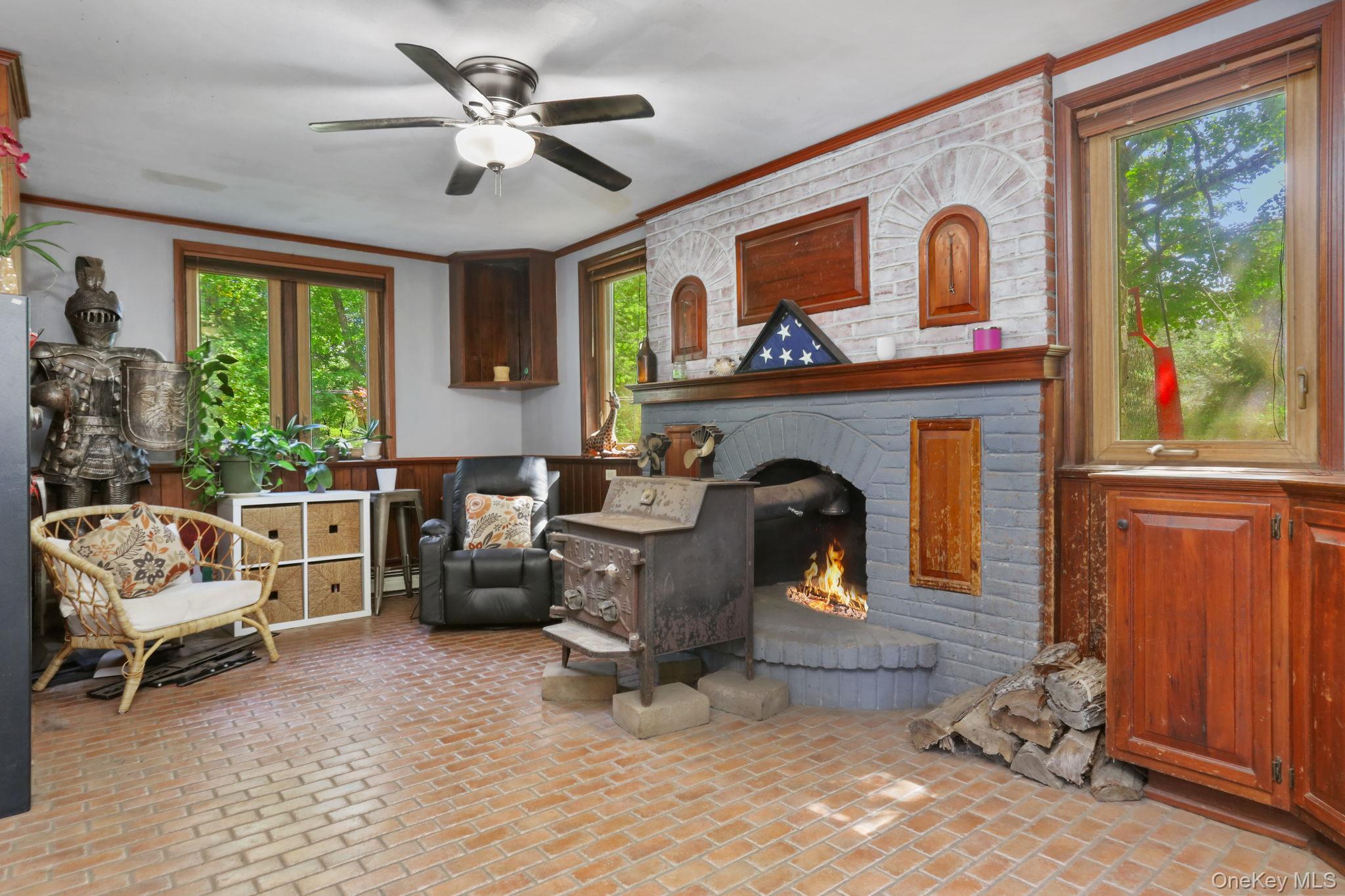 487 Chestnut Ridge Road Dover Plains, NY 12522 - Photo 21 of 41 a living room with furniture and a fireplace