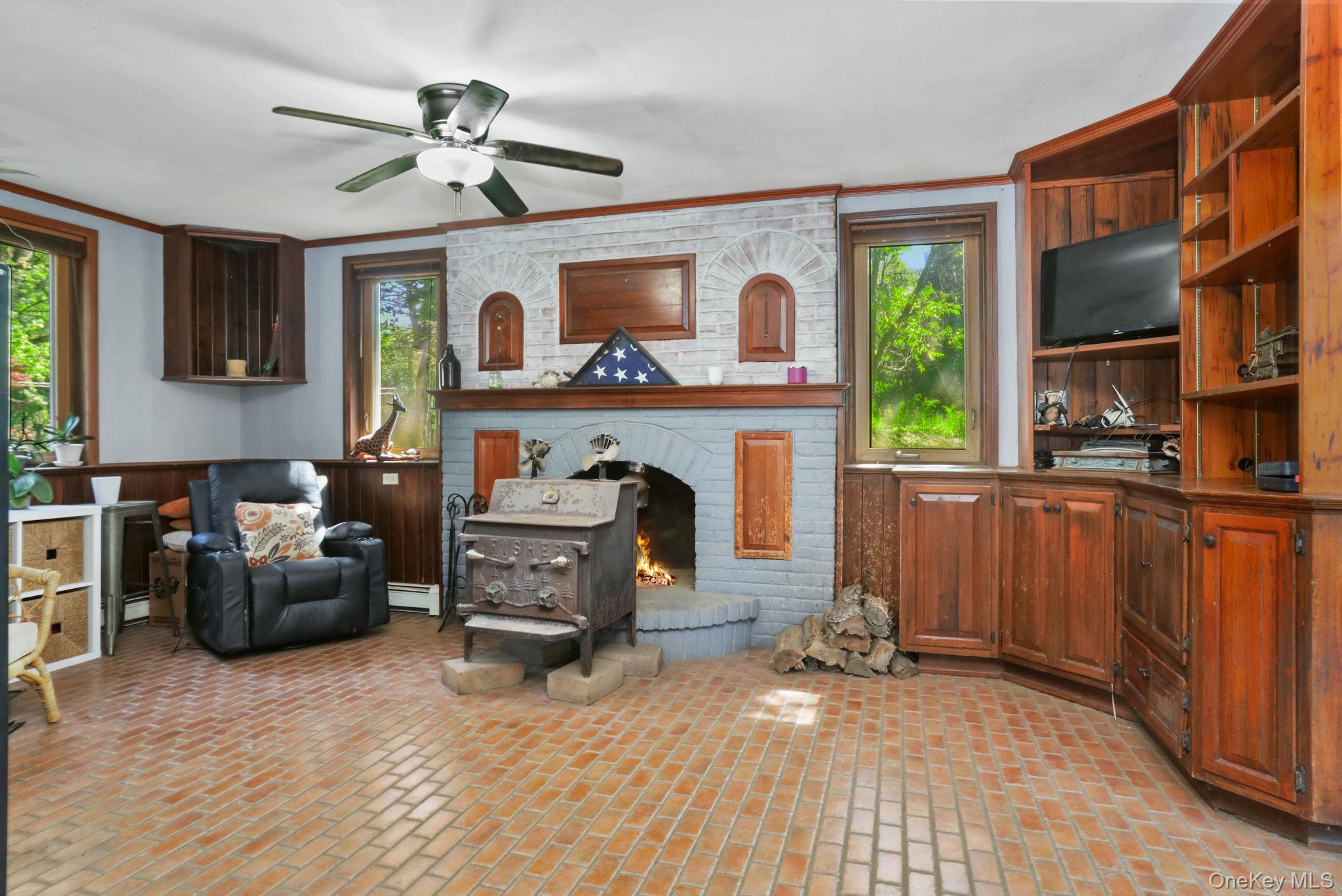 487 Chestnut Ridge Road Dover Plains, NY 12522 - Photo 22 of 41 a living room with furniture and a fireplace