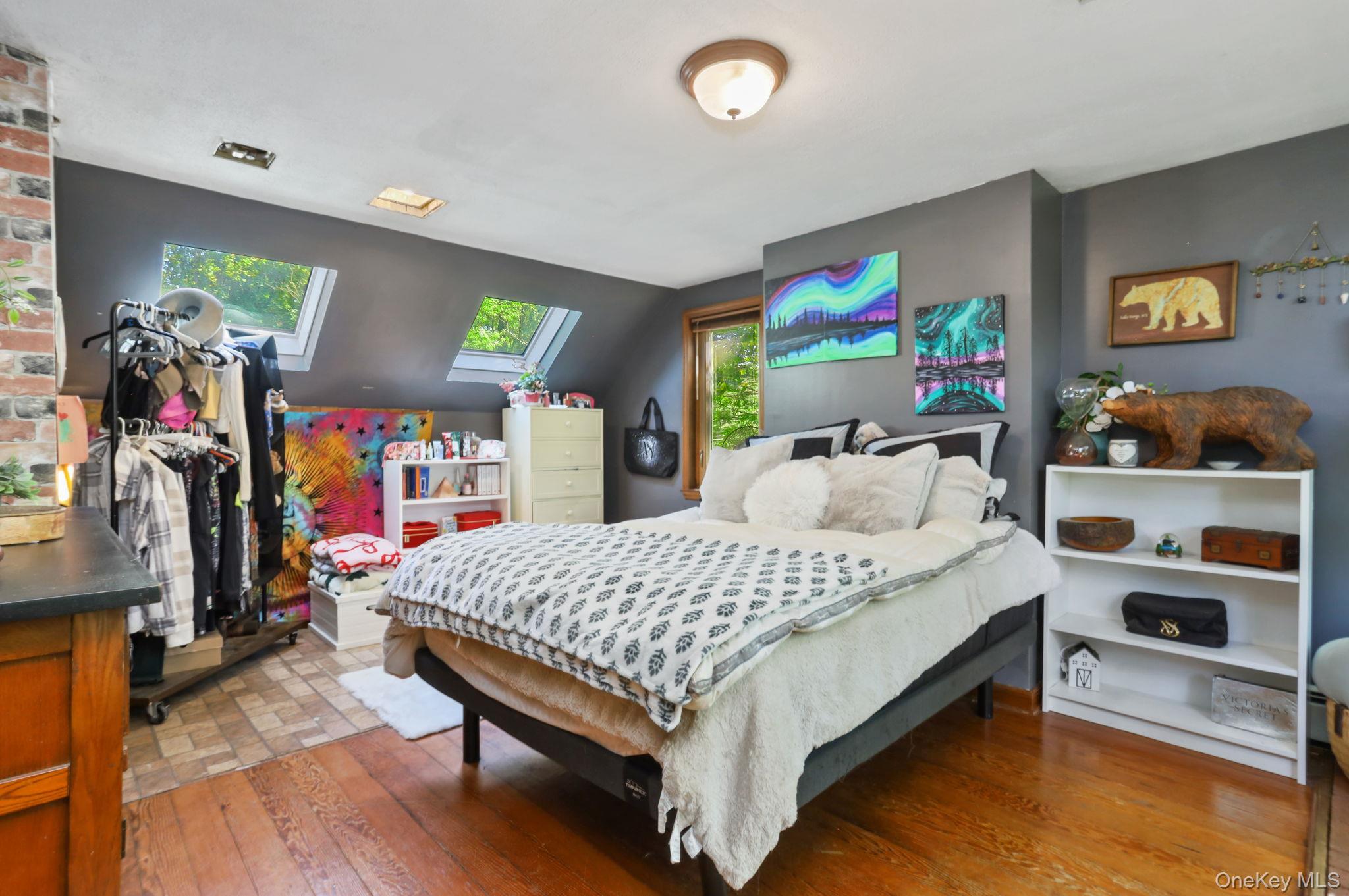 487 Chestnut Ridge Road Dover Plains, NY 12522 - Photo 27 of 41 a bedroom with a bed and a flat tv screen on the dresser
