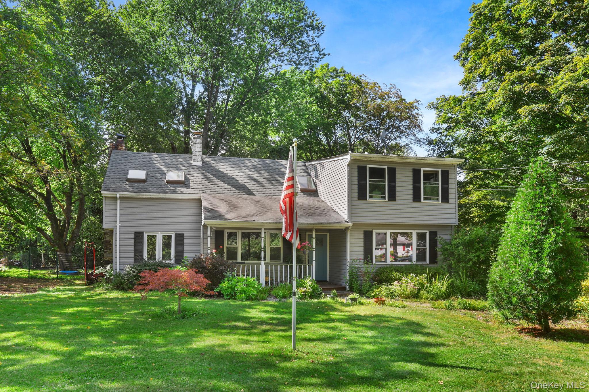487 Chestnut Ridge Road Dover Plains, NY 12522 - Photo 3 of 41 a front view of a house with a yard
