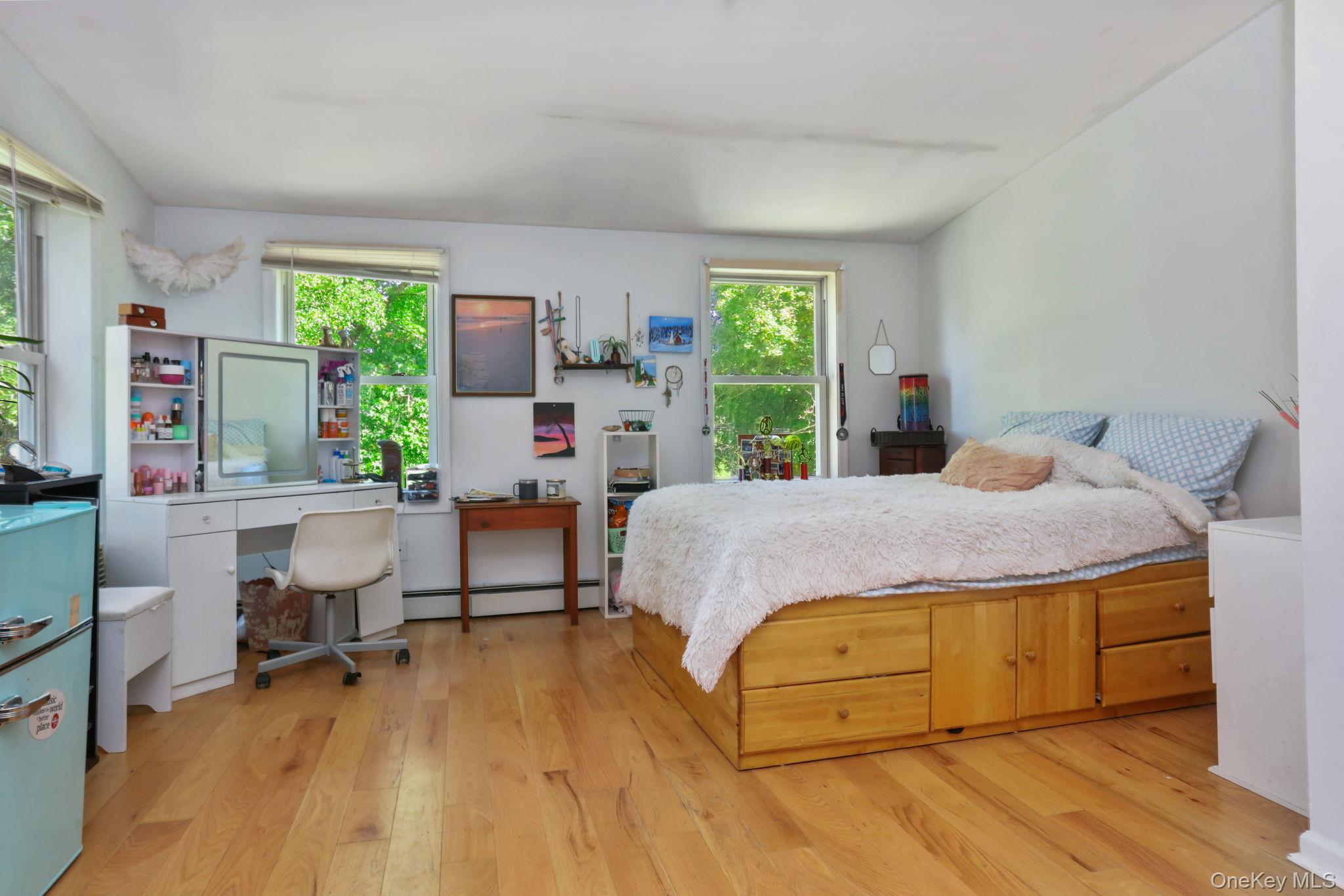 487 Chestnut Ridge Road Dover Plains, NY 12522 - Photo 31 of 41 a bedroom with a bed and large windows