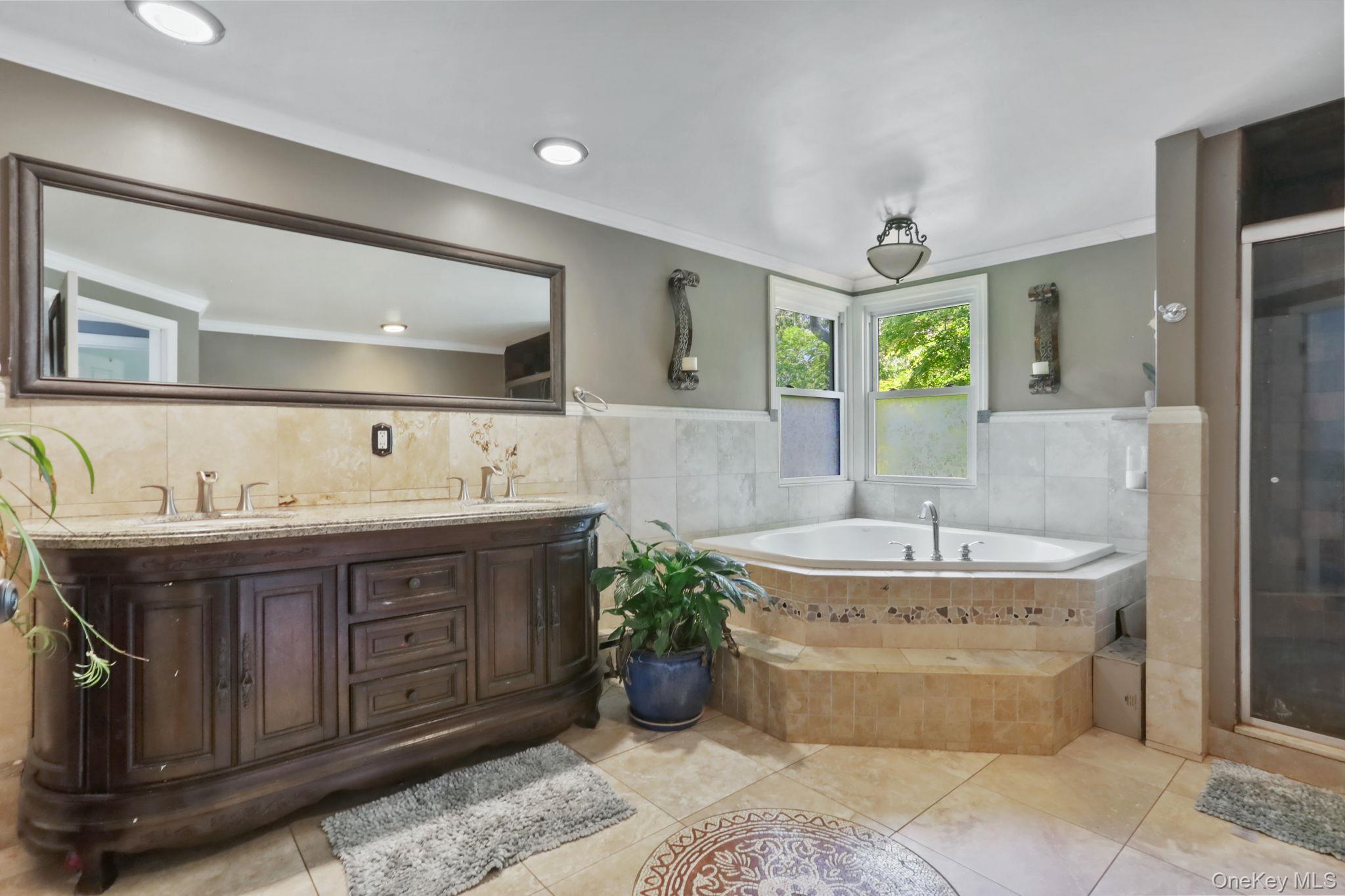 487 Chestnut Ridge Road Dover Plains, NY 12522 - Photo 34 of 41 a spacious bathroom with a tub sink and mirror