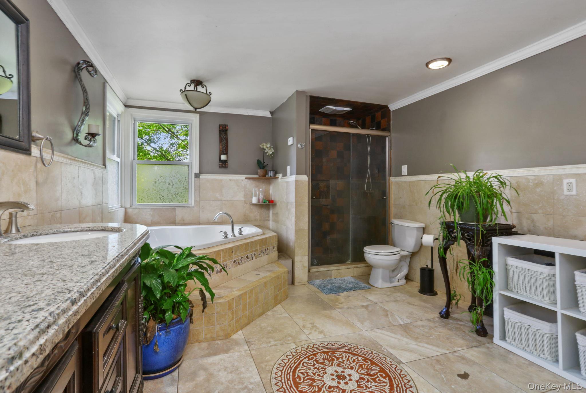 487 Chestnut Ridge Road Dover Plains, NY 12522 - Photo 35 of 41 a spacious bathroom with a granite countertop tub a mirror and shower