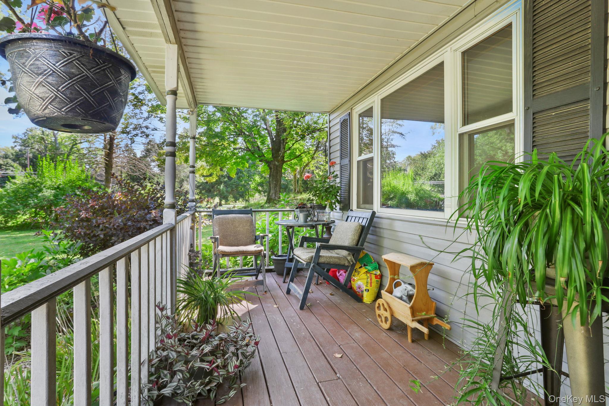 487 Chestnut Ridge Road Dover Plains, NY 12522 - Photo 6 of 41 a view of a chair and tables in the balcony