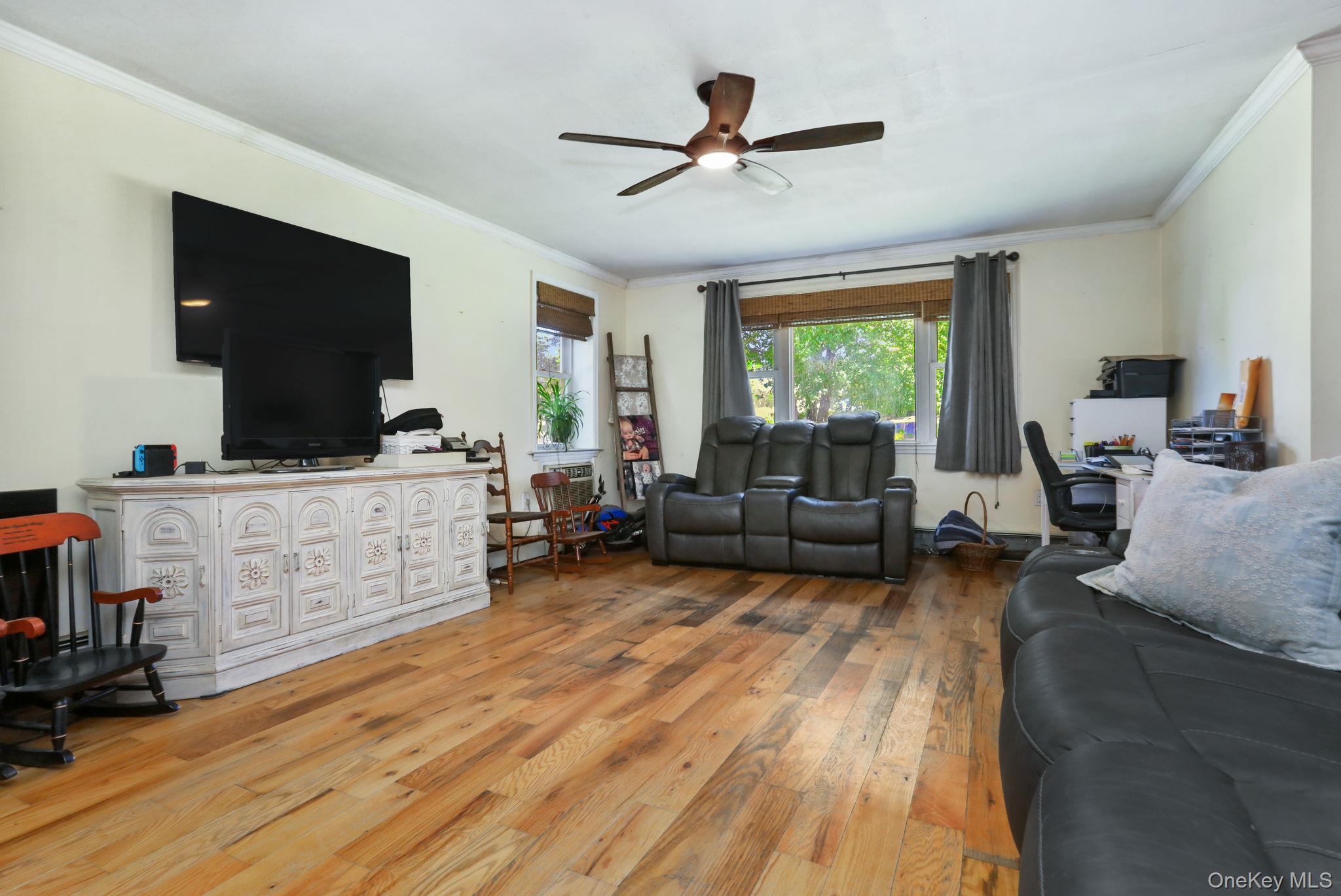 487 Chestnut Ridge Road Dover Plains, NY 12522 - Photo 9 of 41 a living room with furniture a window and a flat screen tv