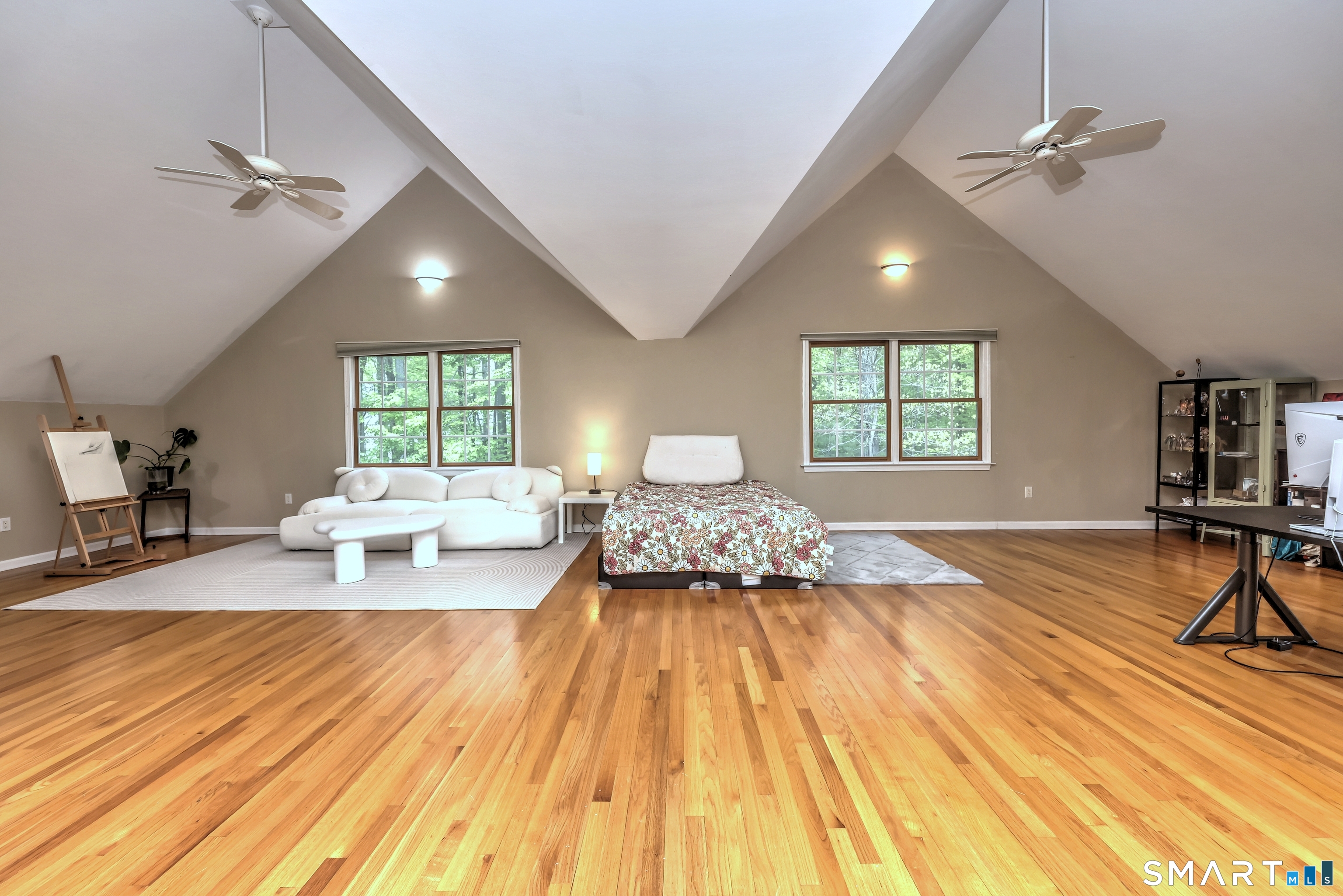 125 Peck Hill Road Woodbridge, CT 06525 - Photo 19 of 40 a bedroom with a bed and a large window