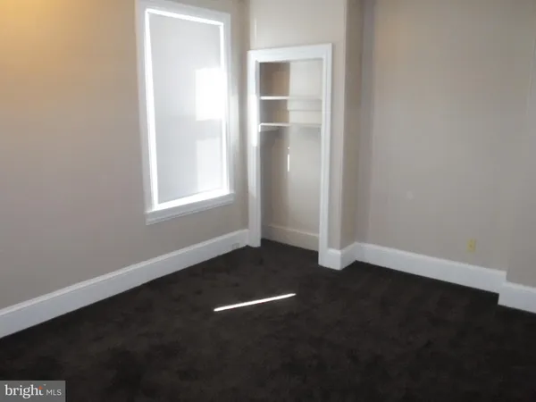 a view of a hallway with a window
