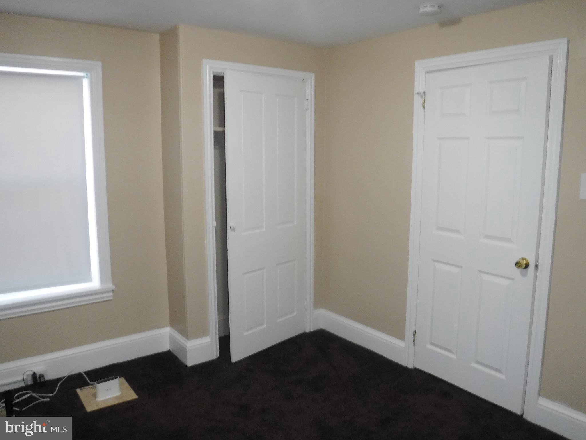 540 George Street Norristown, PA 19401 - Photo 49 of 53 an empty room with wooden floor closet and windows