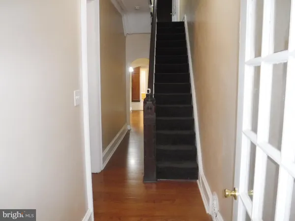 a view of entryway with wooden floor