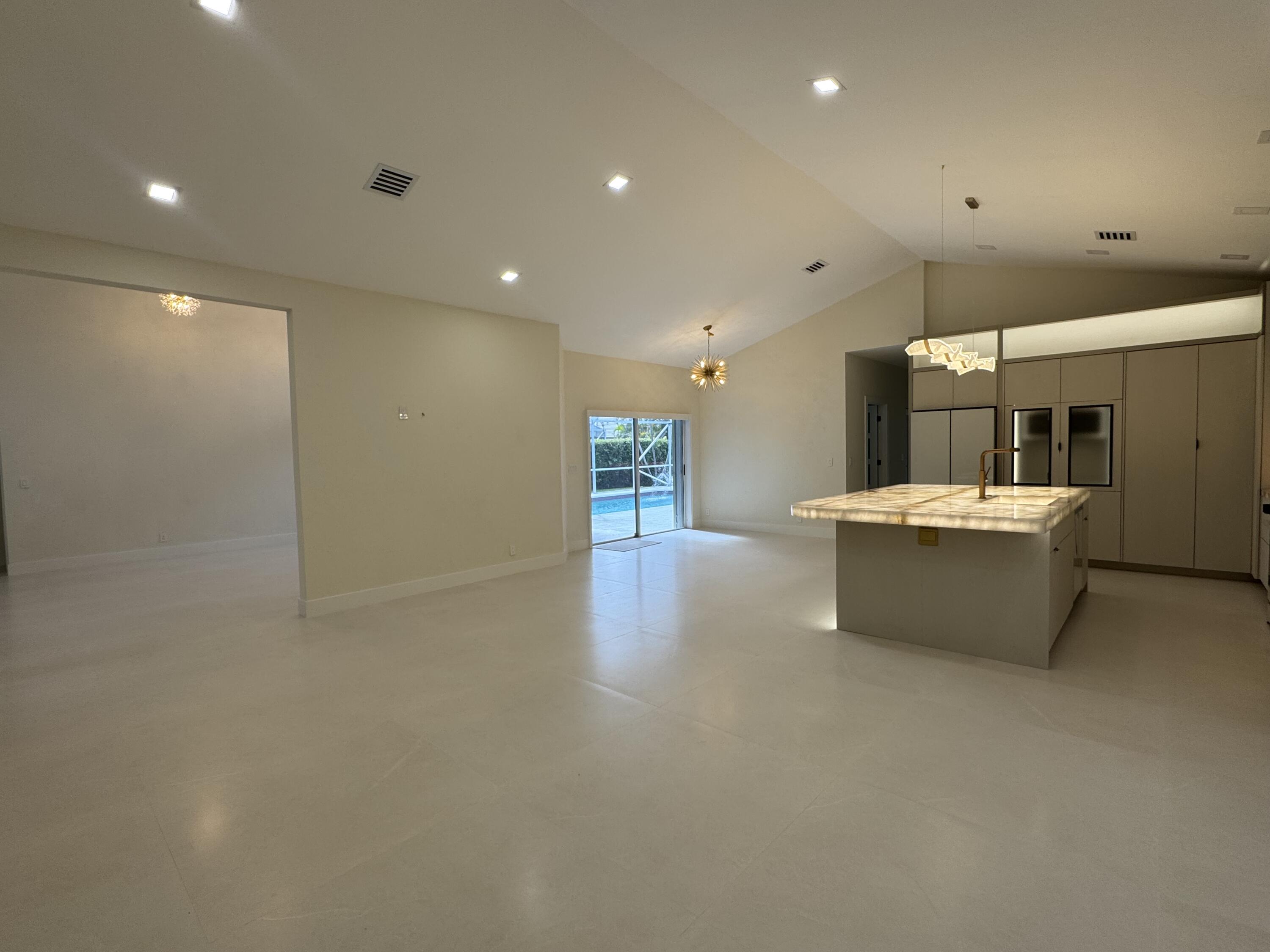 7686 La Corniche Circle Boca Raton, FL 33433 - Photo 11 of 35 a large room with a table and chairs