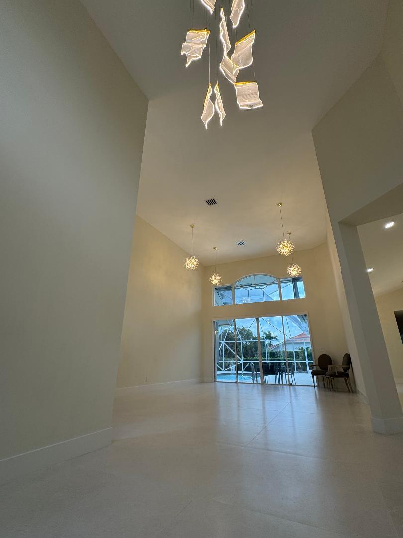 7686 La Corniche Circle Boca Raton, FL 33433 - Photo 15 of 35 wooden floor in an empty room with a window