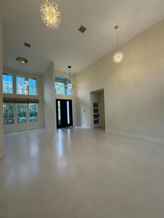 a bathroom with a tub a window and a shower