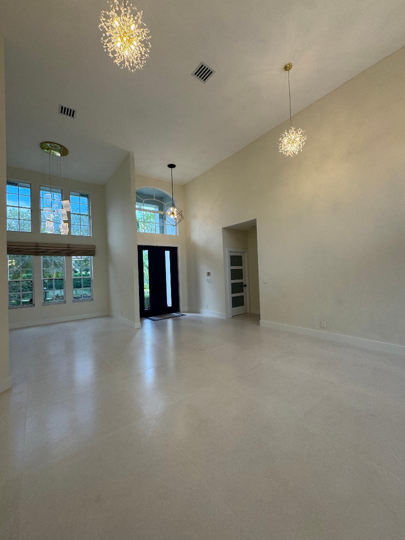 7686 La Corniche Circle Boca Raton, FL 33433 - Photo 17 of 35 wooden floor in an empty room with a window