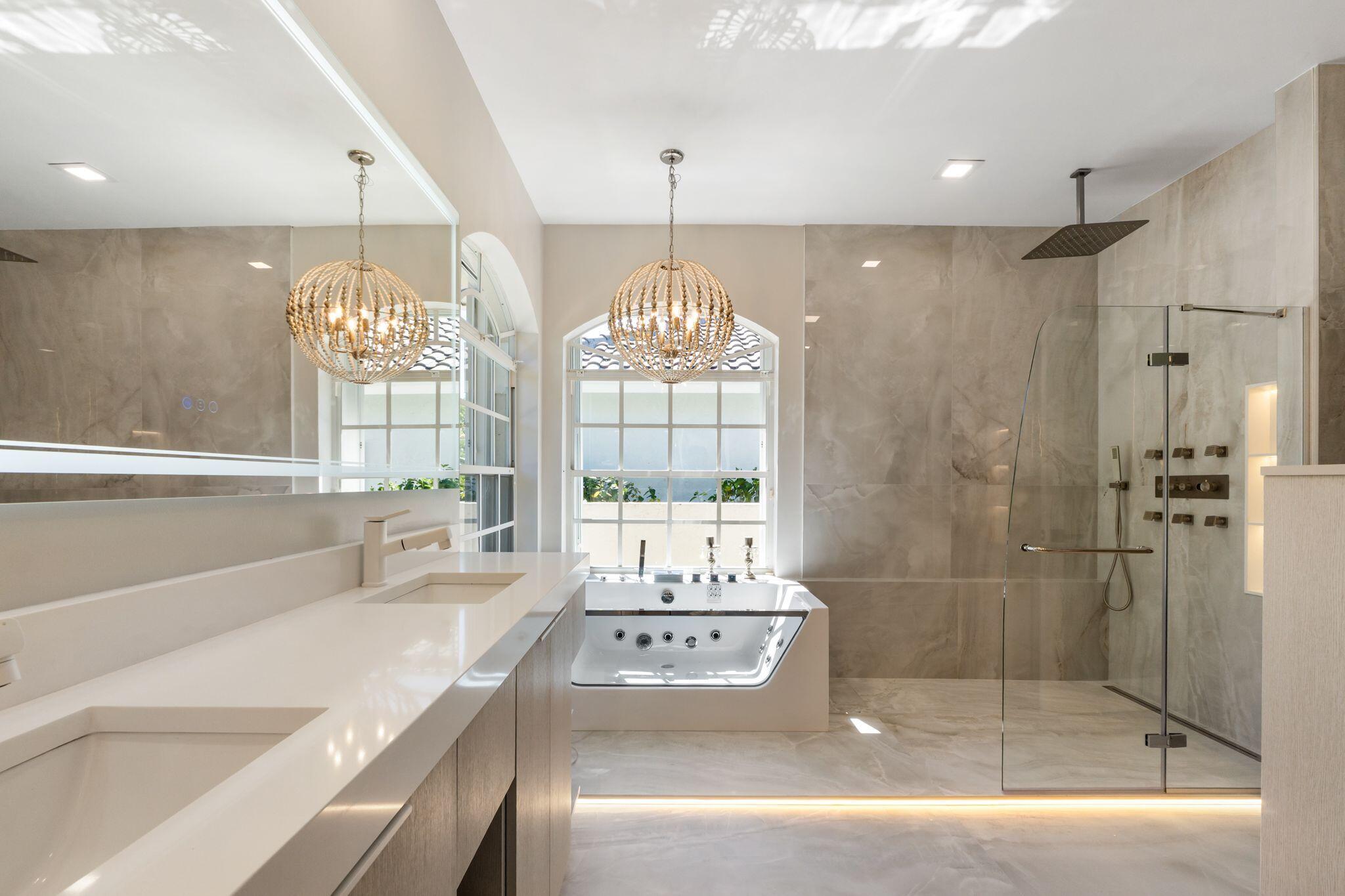 7686 La Corniche Circle Boca Raton, FL 33433 - Photo 19 of 35 a spacious bathroom with a tub sink and mirror