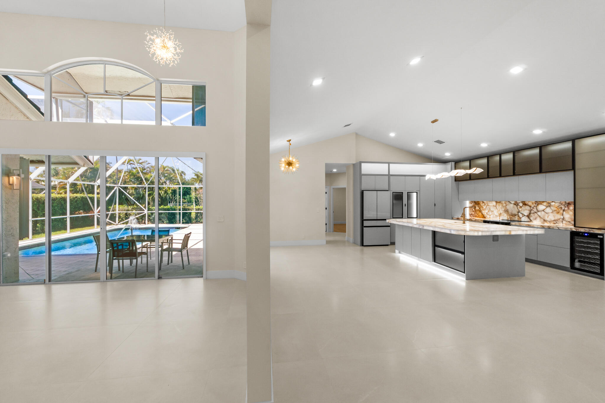 7686 La Corniche Circle Boca Raton, FL 33433 - Photo 2 of 35 a open kitchen with white cabinets and outdoor space