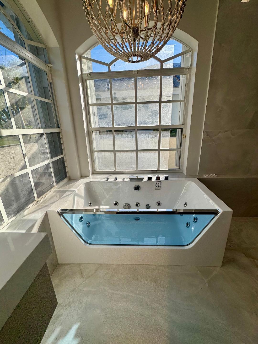 7686 La Corniche Circle Boca Raton, FL 33433 - Photo 21 of 35 a view of a living room with a sink and chandelier