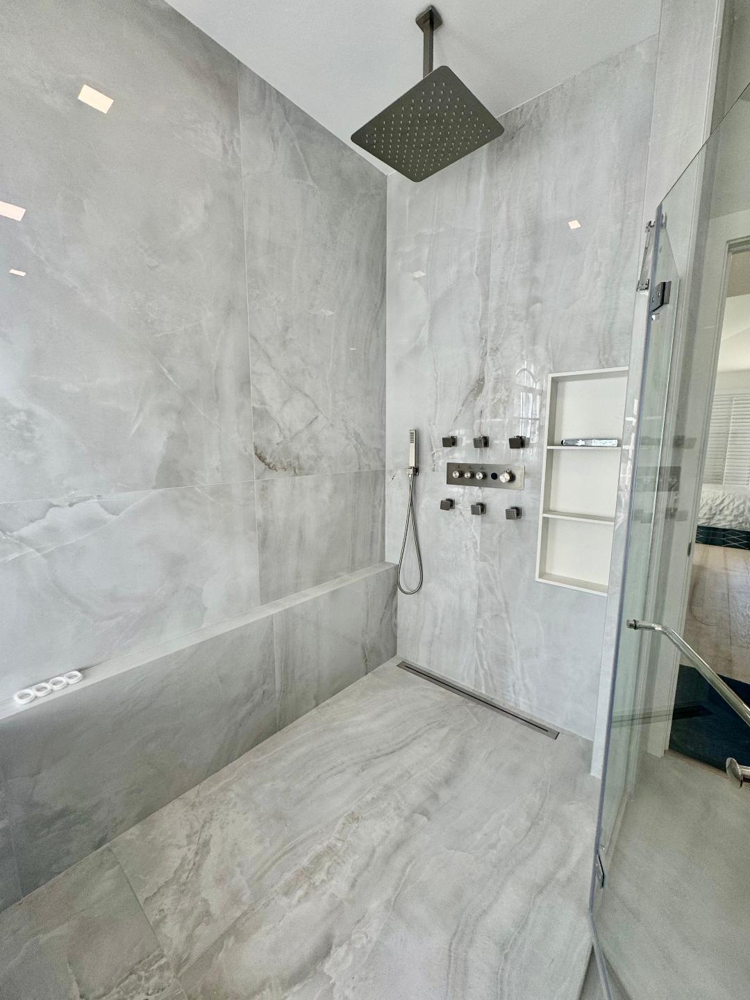 7686 La Corniche Circle Boca Raton, FL 33433 - Photo 22 of 35 a bathroom with a bathtub and a shower