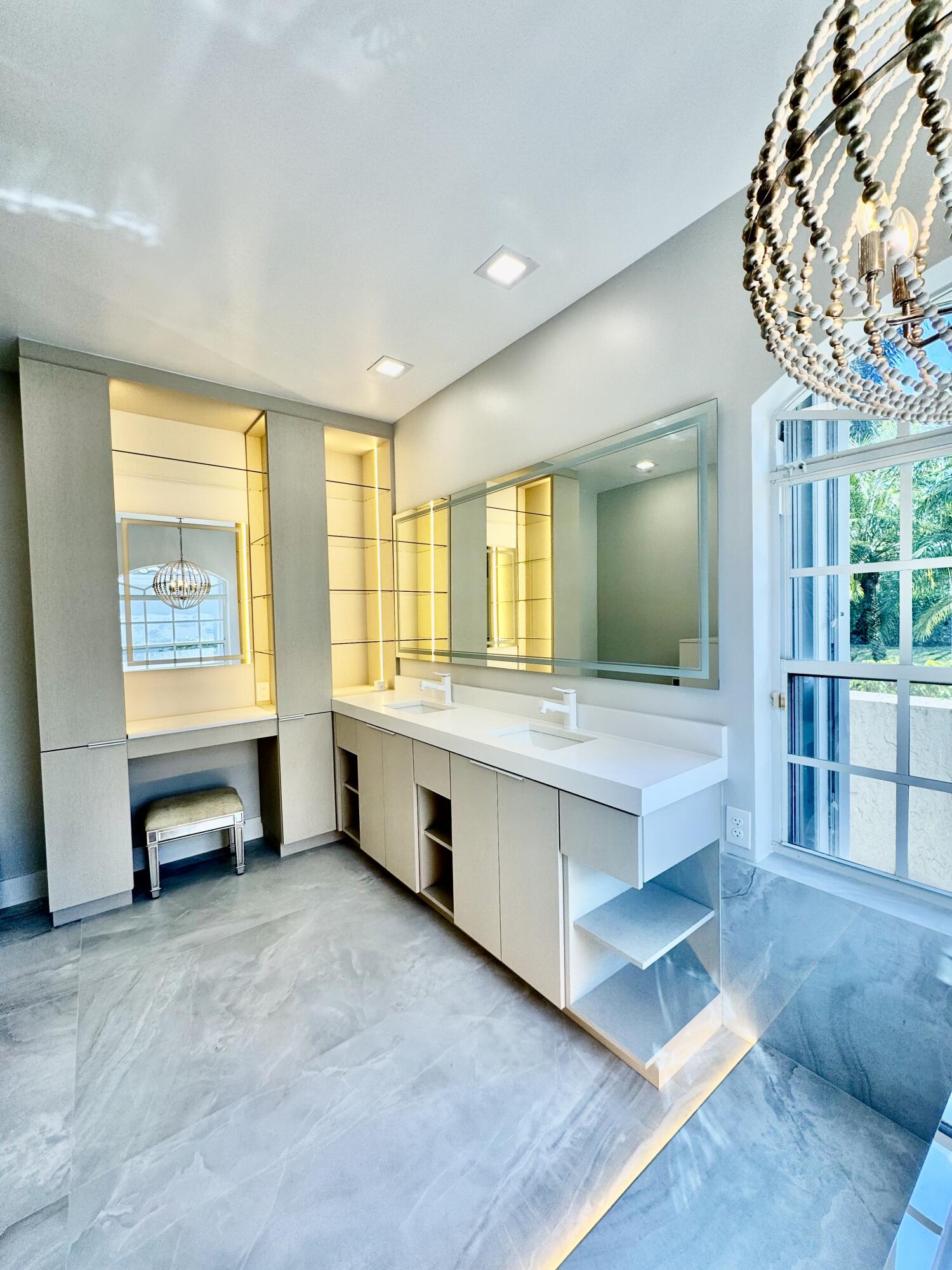 7686 La Corniche Circle Boca Raton, FL 33433 - Photo 23 of 35 a large bathroom with a large tub and sink