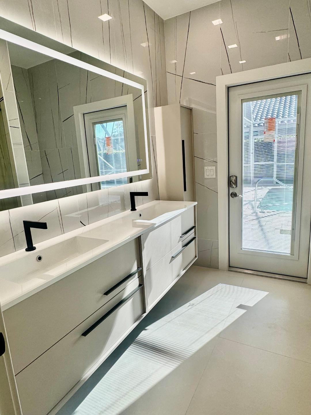 7686 La Corniche Circle Boca Raton, FL 33433 - Photo 27 of 35 a spacious bathroom with double vanity and a shower