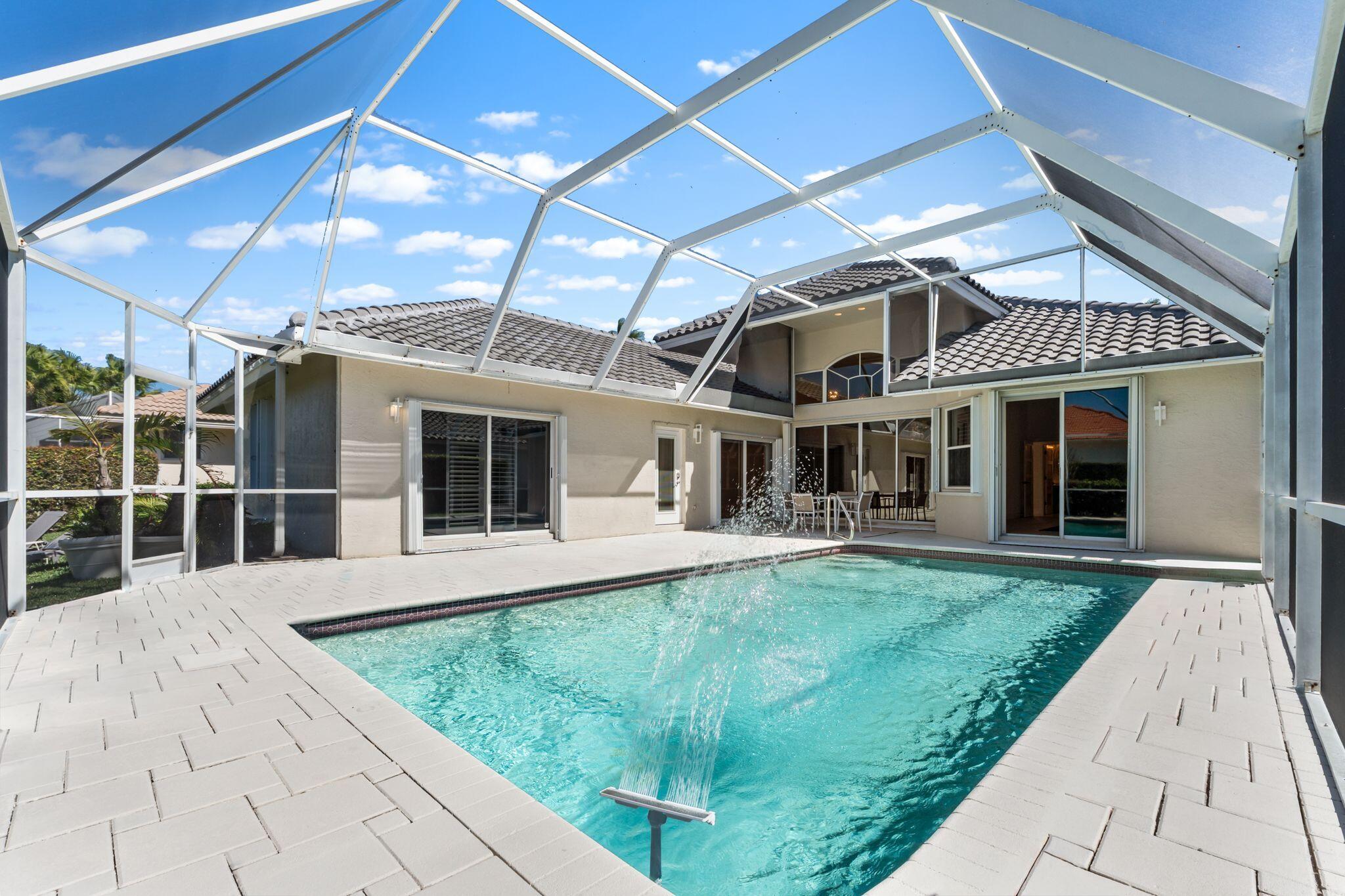 7686 La Corniche Circle Boca Raton, FL 33433 - Photo 32 of 35 a front view of a house with a yard