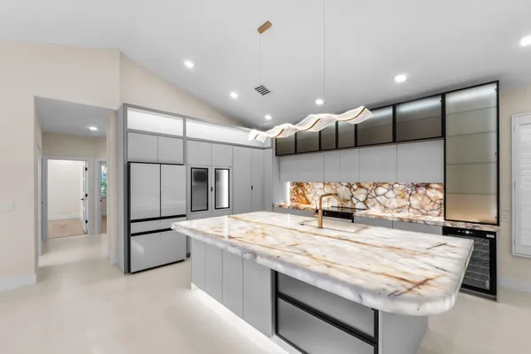 a bathroom with a sink and a large mirror