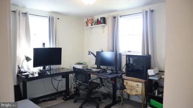 a workspace with furniture and window