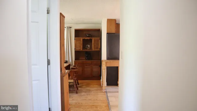 a view of a bathroom from a hallway
